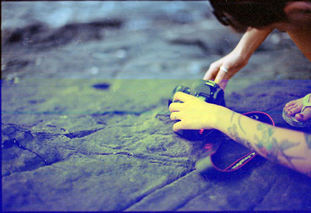 Rock Climbing Route Reading cover illustration with a climber tracing chalk marks and hold sequences on a steep wall
