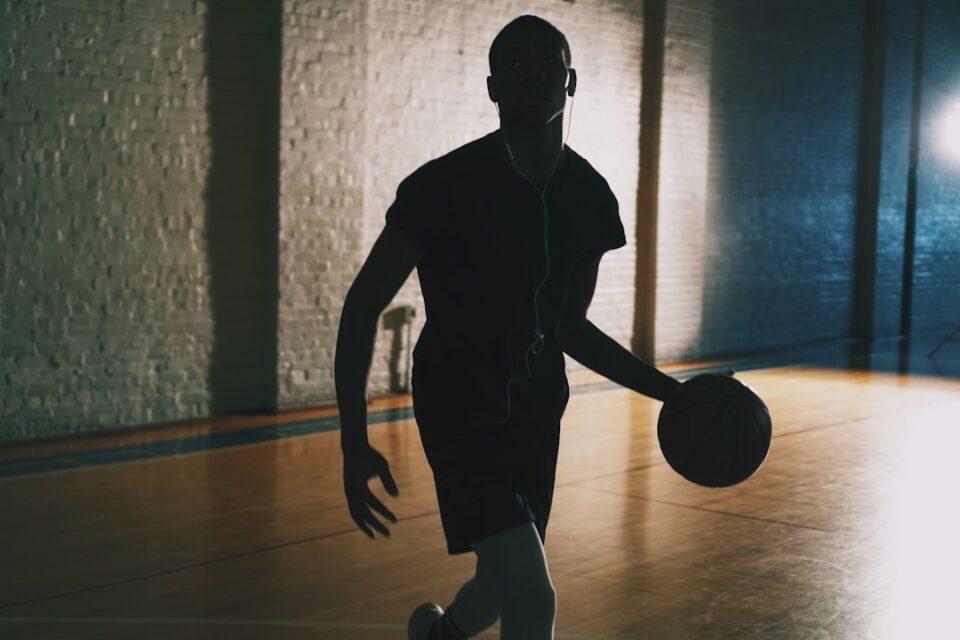basketball shooting form checklist with a player silhouette, shot arc, and alignment cues