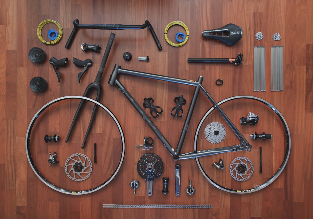 Gravel Bike Maintenance Checklist cover image with tools and a gravel bike on a work stand